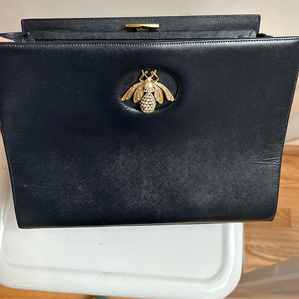Navy leather purse with bejeweled insect closure